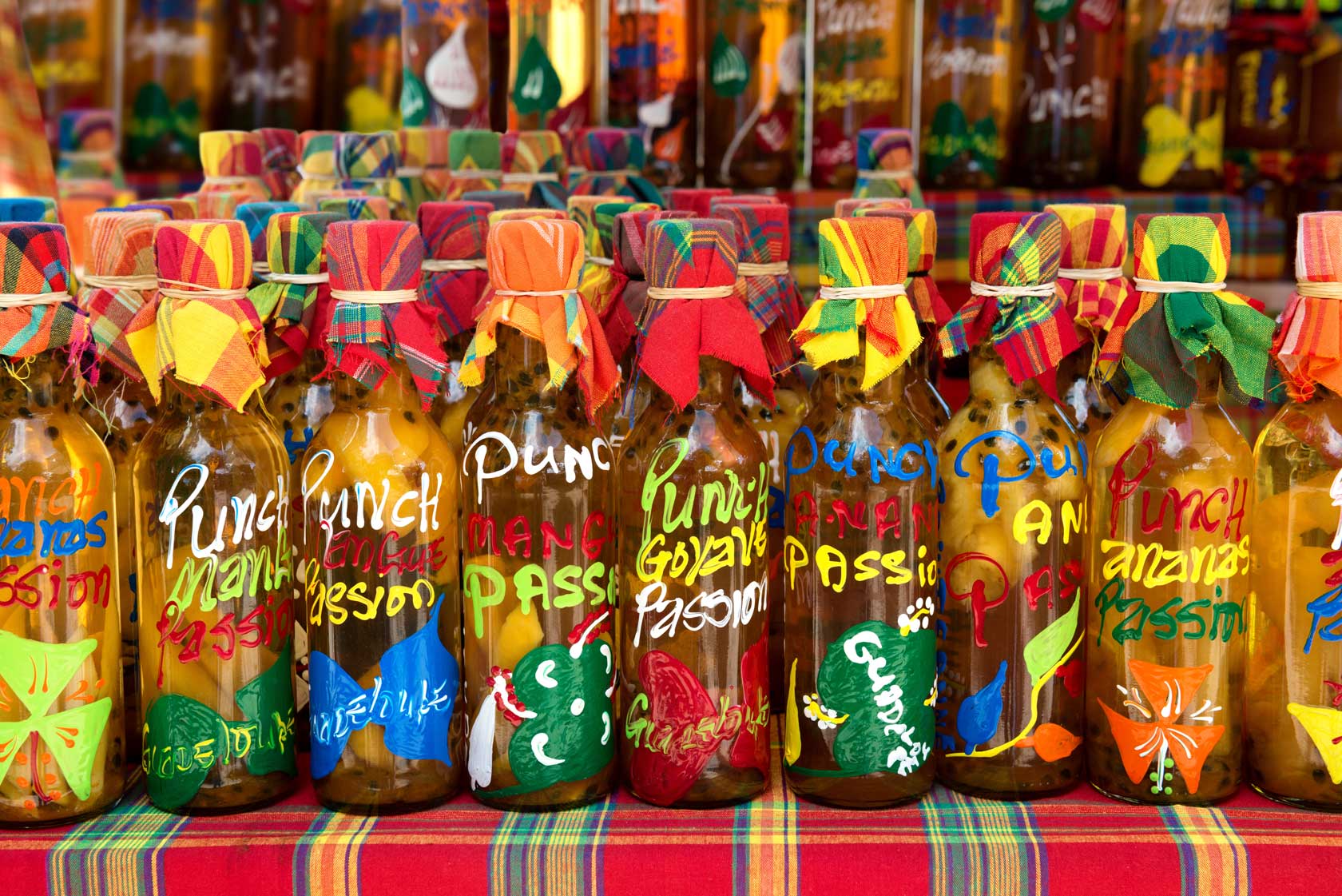 Many different colored rum bottles