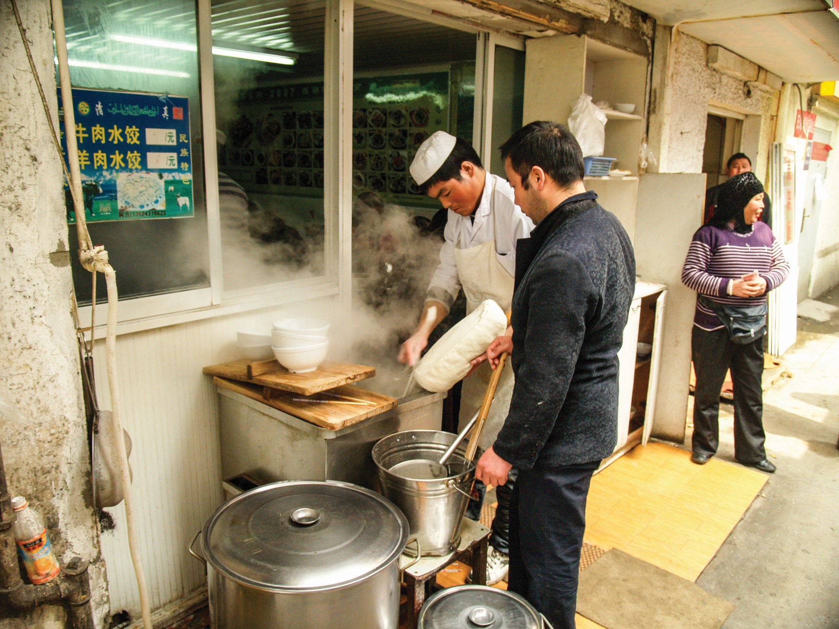 Two men cooking street food 