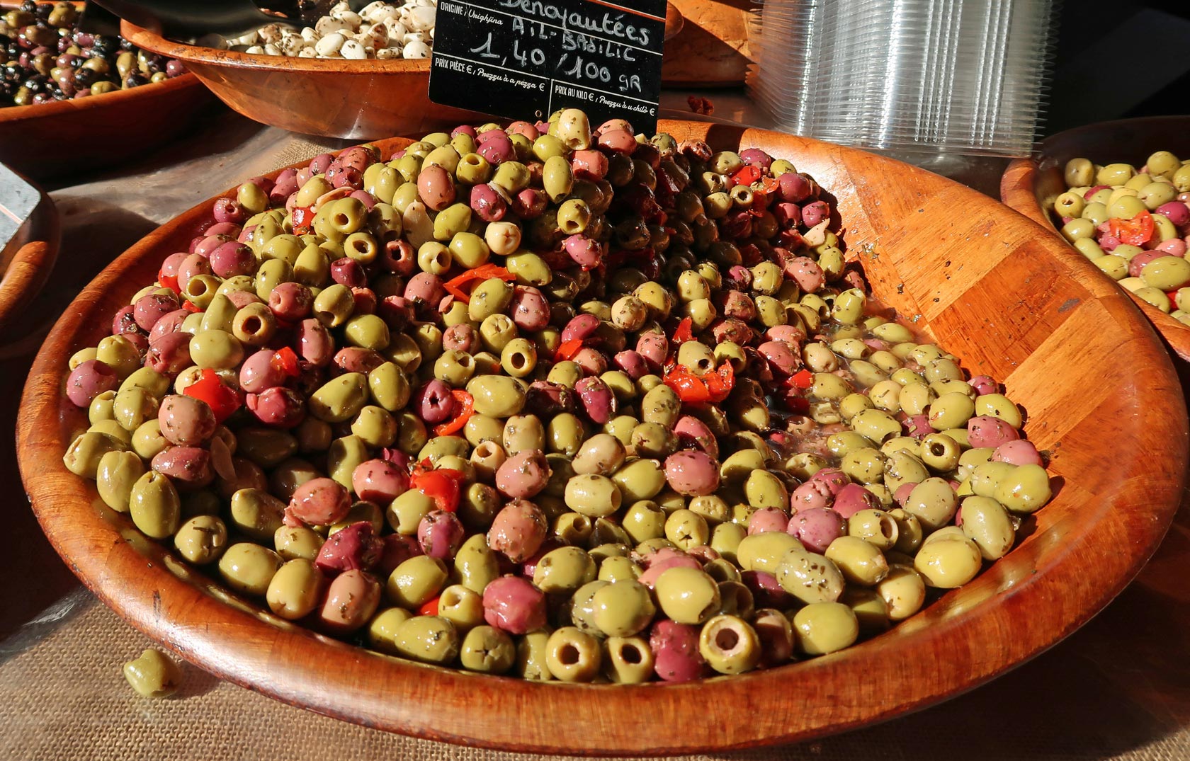 Ajaccio, Corsica, France. Mediterranean culture and colour on cruise vacation. Food in artisan market. Large bowl of olives
