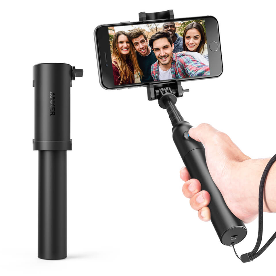 A black small selfie stick with wrist band