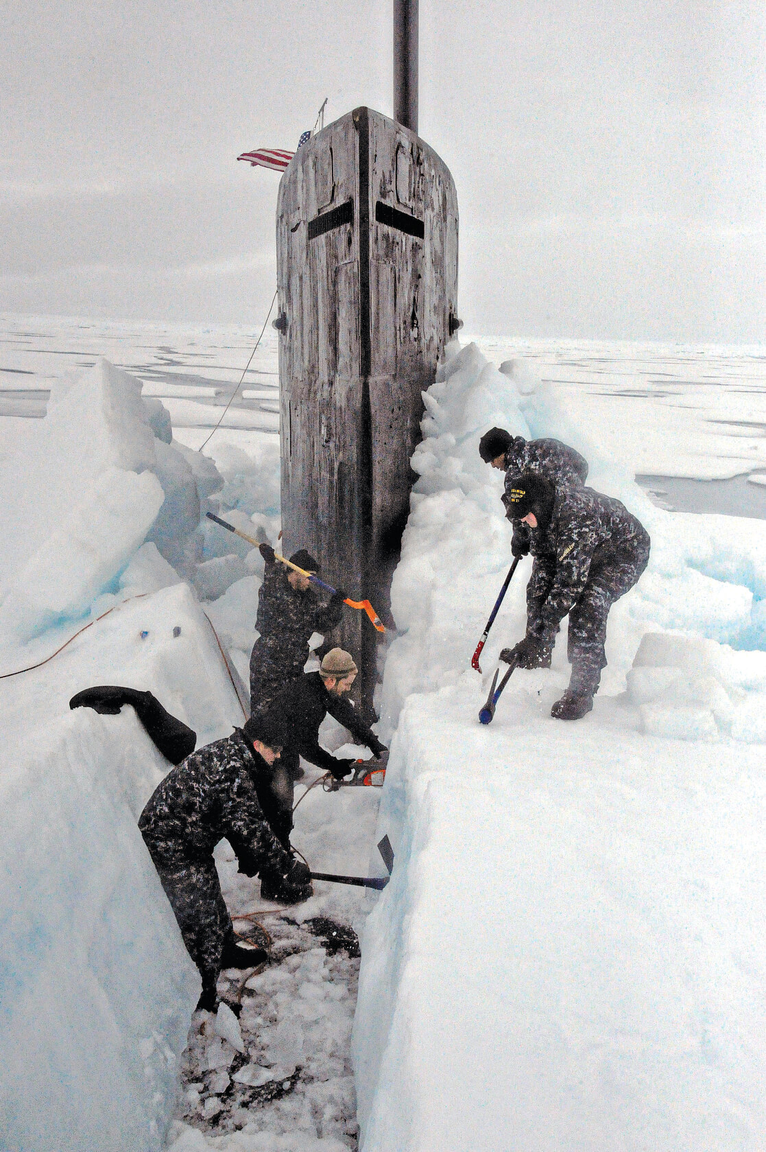 People digging out ice in Alaska