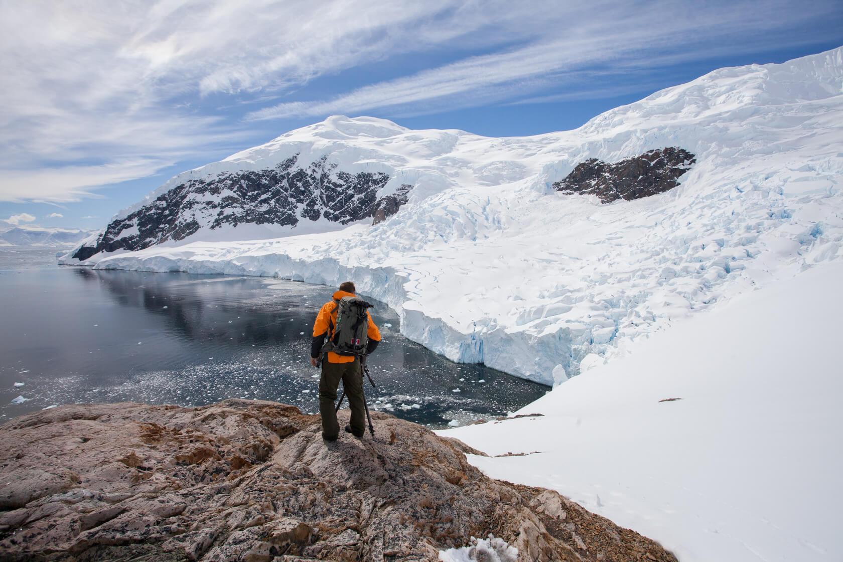 A passenger hikes through Antarctica