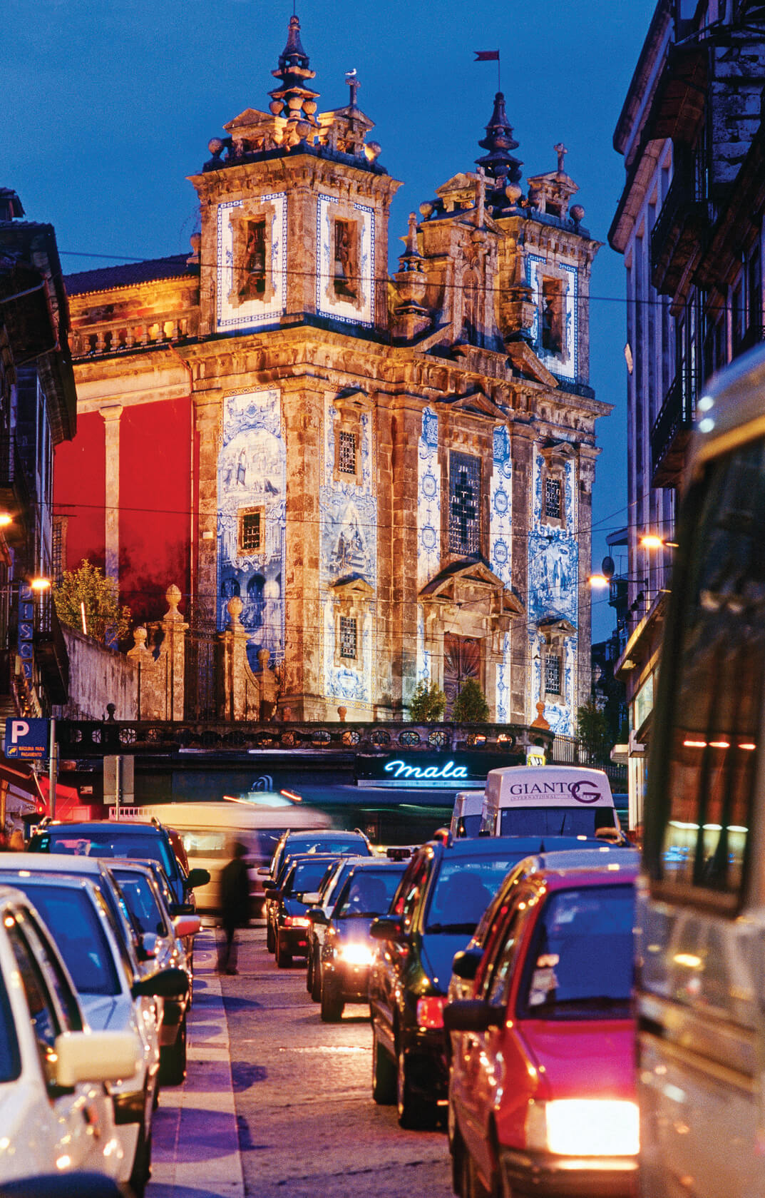 A Lisbon street with lights leading to a church